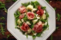 Parma ham and melon salad with mozzarella, rocket and pine nuts Royalty Free Stock Photo