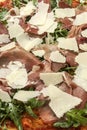 Parma ham, rocket and parmesan cheese gourmet pizza close up Royalty Free Stock Photo