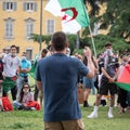 Public Speaking in the Square during a Political Demonstration with Crowd and Algerian Flag