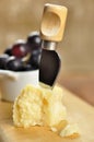 Parmesan cheese and grapes on a chopping board Royalty Free Stock Photo
