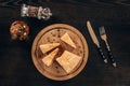 parmesan cheese pieces on wooden board on table Royalty Free Stock Photo