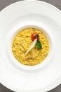 Parmesan cheese risotto on a white porcelain plate