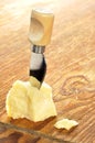 Parmesan cheese on a wooden chopping board Royalty Free Stock Photo