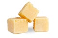 Parmesan grana padano cheese cubes isolated on white . Royalty Free Stock Photo
