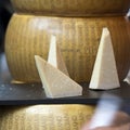 The Parmesan is on the table for sale on the market. Parmigiano-Reggiano is made from unpasteurized cow`s milk.