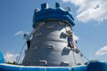 Boy and girl climbing on rope at high inflatable tower