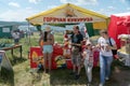 People buy hot corn in a tent at the Karatag festival of music and crafts. Royalty Free Stock Photo