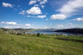 Parnaya village is located on the shore of Lake Bolshoye on a sunny summer day. Krasnoyarsk region. Russia