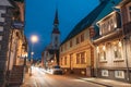 Parnu, Estonia. Night Puhavaimu Street With Old Wooden Houses, Restaurants, Cafe, Hotels And Shops In Evening Night