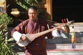 PARO, BHUTAN - November10, 2012 : Unidentified old man musician