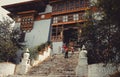 Paro, Bhutan - September 10, 2016: Low angle view of tourists standing on an old temple stairs.