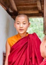 Paro, Bhutan - September 17, 2016: Young Bhutanese monk standing at the entrence of a monastery in Paro, Bhutan