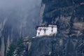 Paro Taktsang , also known as the Taktsang Palphug Monastery and the Tiger`s Nest seen from the bottom on a foggy day