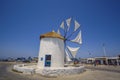 PAROS, CYCLADES, GREECE - JUNE 2017: Traditional cycladic windmill against a deep blue sky in a beautiful summer day on Paros Royalty Free Stock Photo