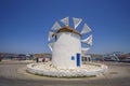 PAROS, CYCLADES, GREECE - JUNE 2017: Traditional cycladic windmill against a deep blue sky in a beautiful summer day on Paros Royalty Free Stock Photo