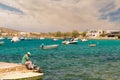 Paros, Greece 1 August 2016. Man fixing the fishing net at Alyki beach at Paros island in Greece.