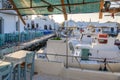 Boats and fish restaurant in beautiful Naoussa harbor on Paros Island. Cyclades, Greece