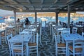 PAROS.GREECE.SEPTEMBER 2018 First customers for morning coffee in a bar at the port of Lefkes, Paros Royalty Free Stock Photo