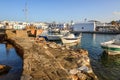 Naoussa harbor with colorful boats and houses in the Cycladic style, Paros island, Greece.