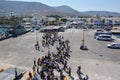 PAROS, GREECE - SEPTEMBER 17, 2016: Passengers and cars embark on a ship at the port of Paros in Greece.