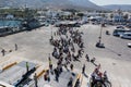 PAROS, GREECE - SEPTEMBER 17, 2016: Passengers and cars embark on a ship at the port of Paros in Greece.