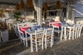 Seaside restaurant in beautiful Naoussa harbor on Paros Island. Cyclades, Greece Royalty Free Stock Photo