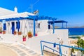 Typical Greek whitewashed house on street in Naoussa town on Paros island, Greece Royalty Free Stock Photo