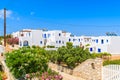 View of street with typical Greek holiday apartments in Naoussa town, Paros island, Greece Royalty Free Stock Photo