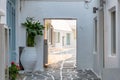 Paros island, Greece. Naousa old town. Whitewashed building, empty narrow cobblestone alley Royalty Free Stock Photo