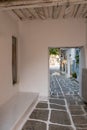 Paros island, Greece. Naousa old town. Whitewashed building, empty narrow cobblestone alley Royalty Free Stock Photo