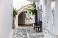 Paros island, Greece. Naousa old town. Whitewashed building, empty narrow cobblestone alley Royalty Free Stock Photo