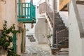 Paros island, Greece. Whitewashed building, empty narrow cobblestone street at Naousa old town Royalty Free Stock Photo