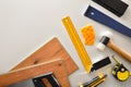 Parquet installer material and tools background on white table top Royalty Free Stock Photo