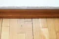 Parquet and wooden baseboard close-up. Marriage of finishing work, poor quality. Royalty Free Stock Photo