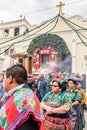 Traditionallly dressed locals participate in religious procession, Guatemala