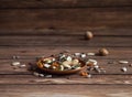 Parrot food is scattered on the wooden table. Royalty Free Stock Photo