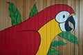 Parrot painting on the wood wall Royalty Free Stock Photo