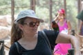 Parrot sits on the hand of a young woman at the Australian Zoo Gan Guru in Kibbutz Nir David, in Israel