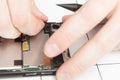 Parsing a mobile phone. Wizard detaches smartphone parts