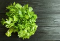 Parsley bunches on a black wooden