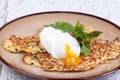 Parsnip pancakes with pouched eggs Royalty Free Stock Photo