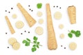 Parsnip root and slices with parsley peppercorns isolated on white background with clipping path. Top view. Flat lay Royalty Free Stock Photo