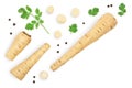 Parsnip root and slices with parsley peppercorns isolated on white background with copy space for your text. Top view Royalty Free Stock Photo