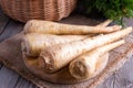 Parsnips on a wooden cutting board Royalty Free Stock Photo