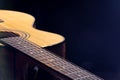 Part of acoustic guitar on black background copy space Royalty Free Stock Photo