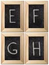 Part of the alphabet drawing with chalk on the old scratched chalkboard background with wooden frame. Letters: E, F, G Royalty Free Stock Photo