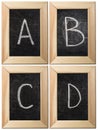 Part of the alphabet drawing with chalk on the old scratched chalkboard background with wooden frame. Letters: A, B, C Royalty Free Stock Photo