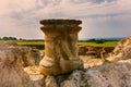 Part of ancient pillar outdoors.