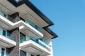 Part of an apartment building against the blue sky Royalty Free Stock Photo