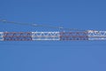 Part of arm machinery construction crane with blue sky background Royalty Free Stock Photo